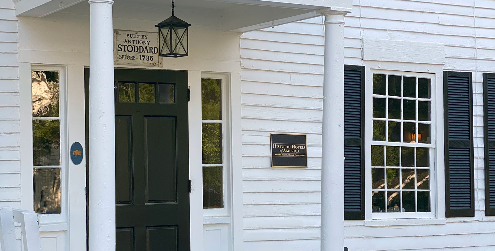 a white house with a sign on the front
