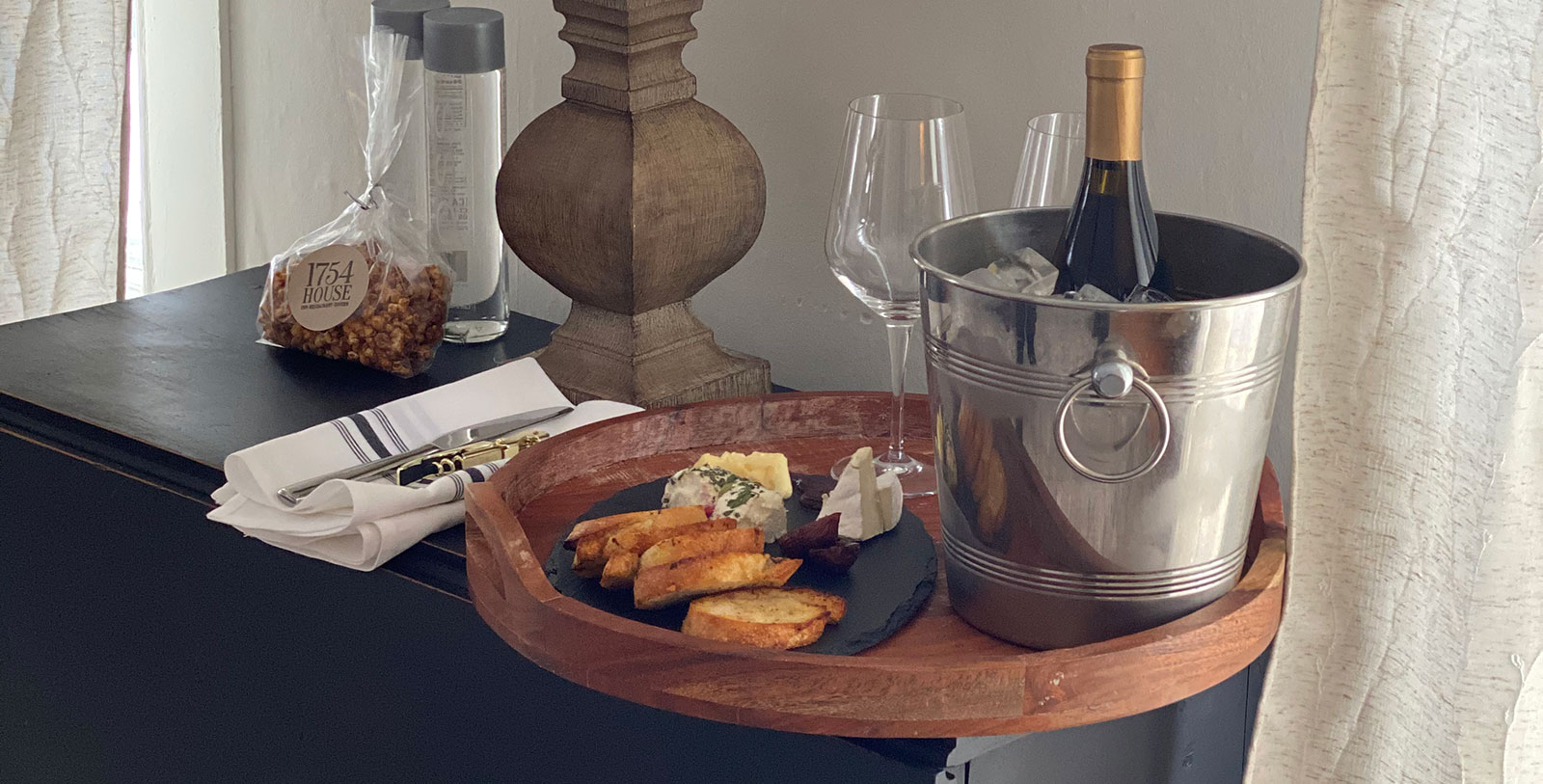 a plate of food and wine on a table