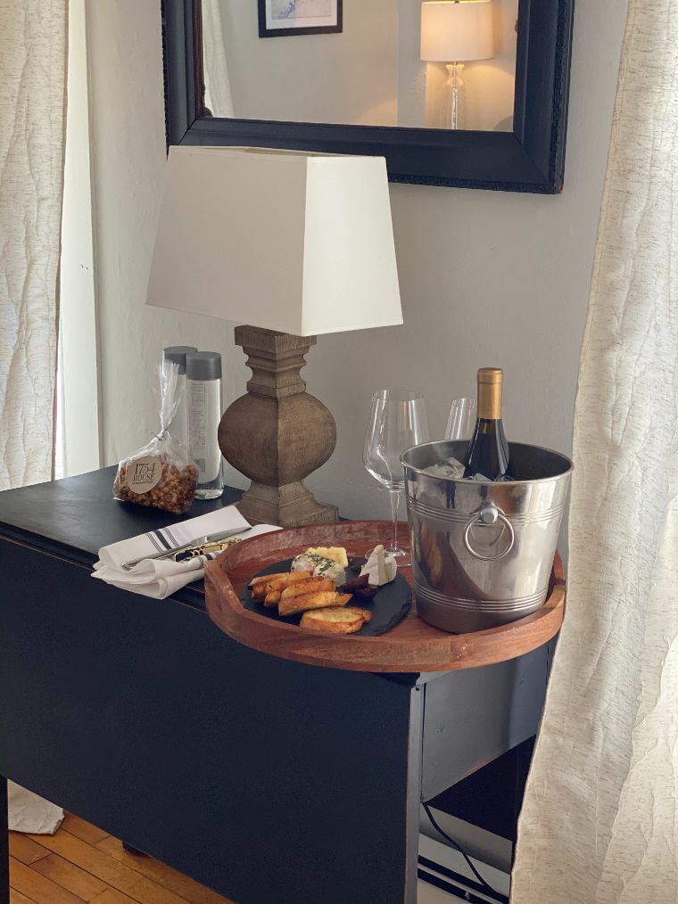 a table with a tray of food and a lamp