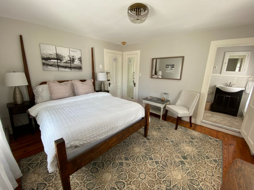 a bedroom with a bed and a rug