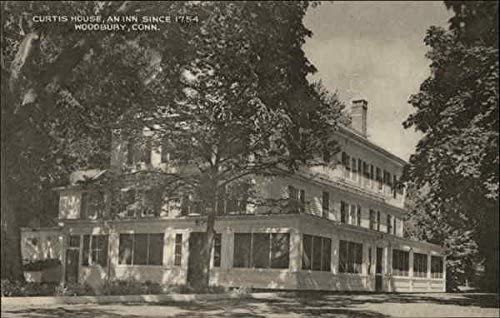 a large building with trees in front