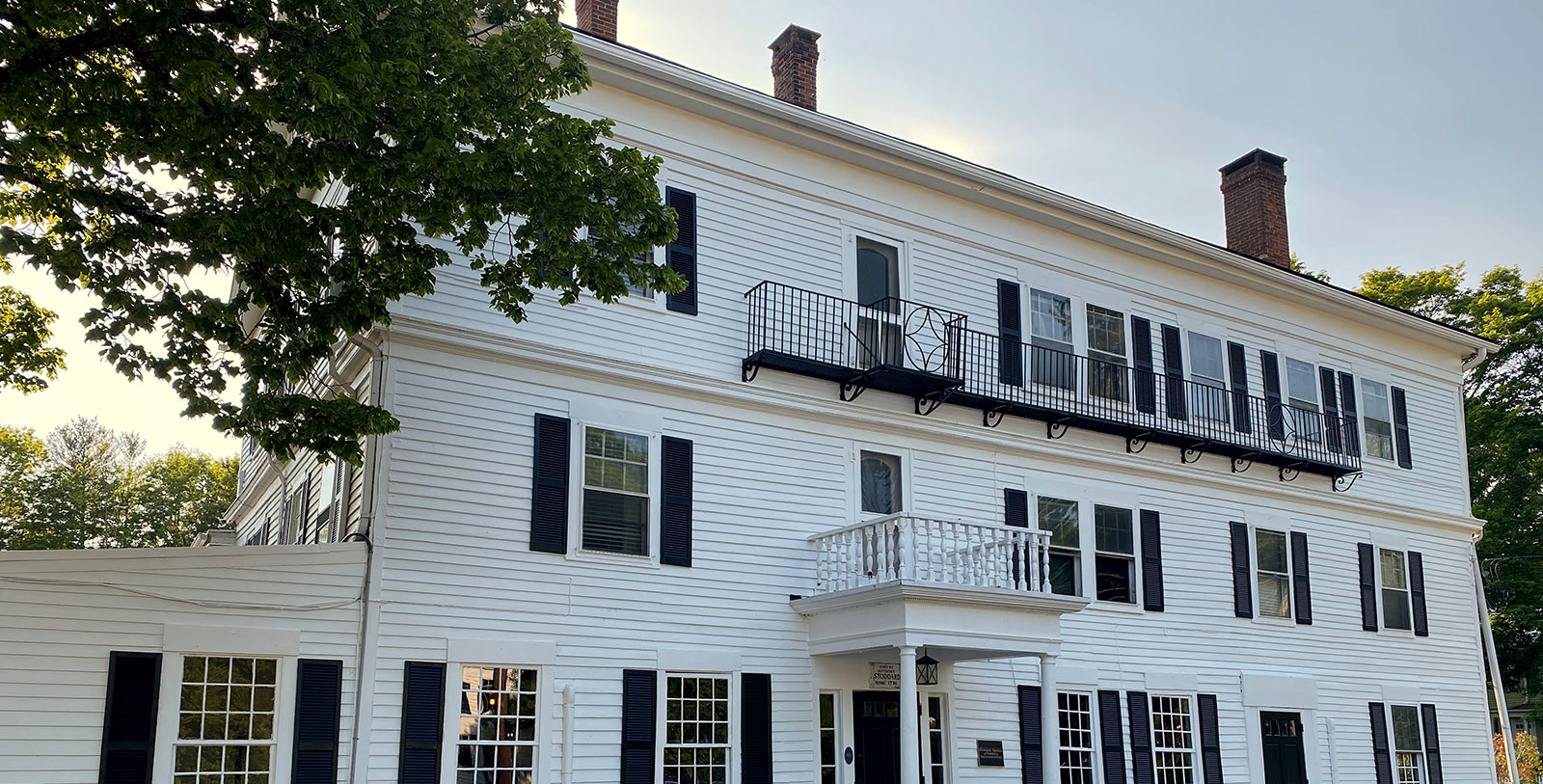 a white building with black shutters