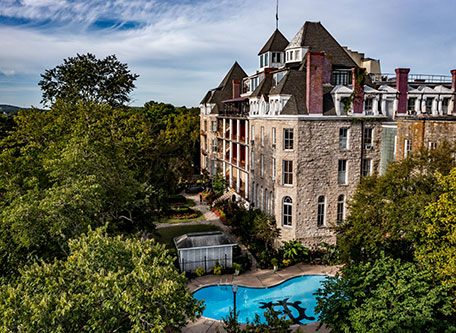 a building with a pool in the middle of it
