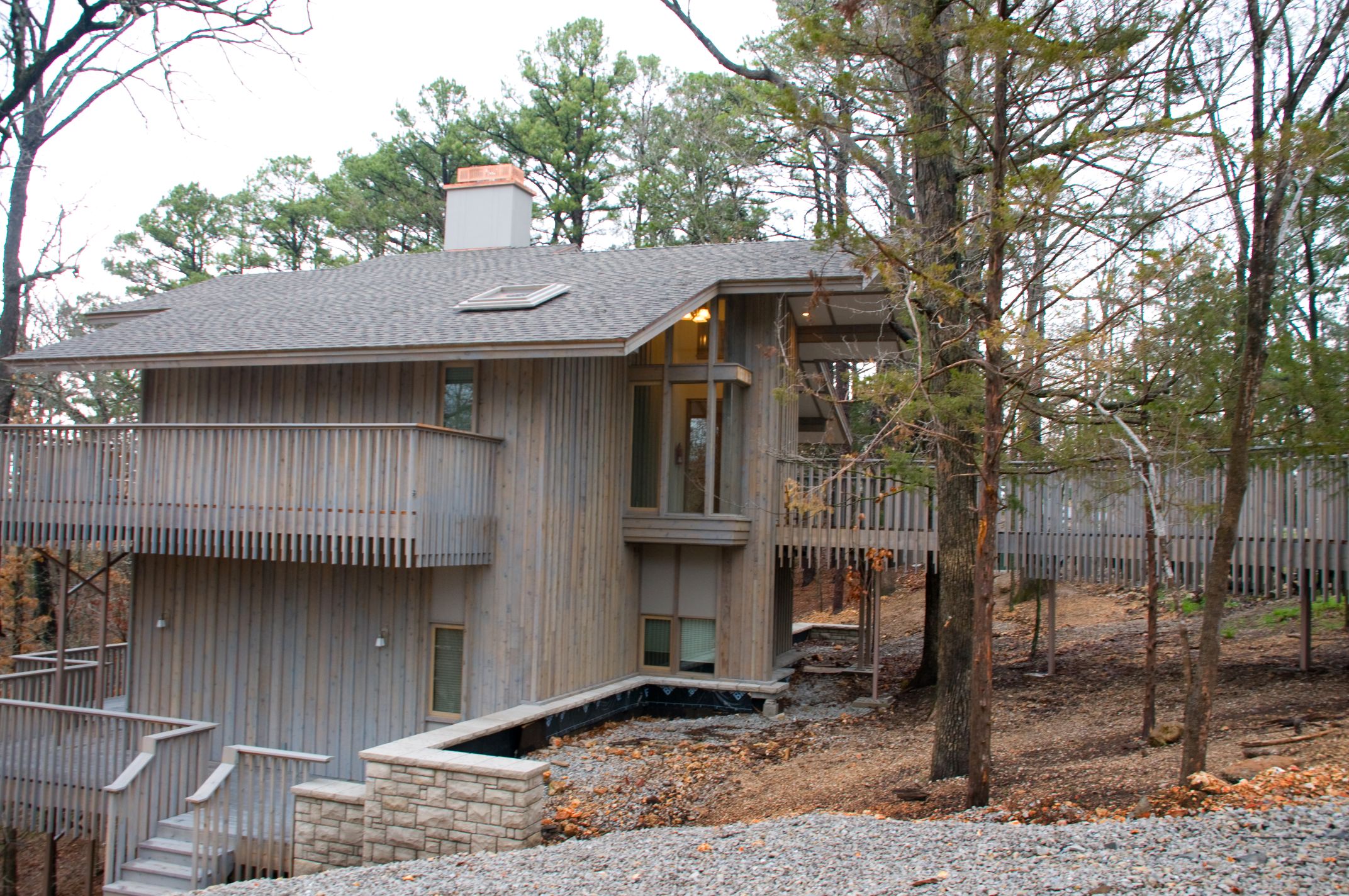 a house with a deck and trees