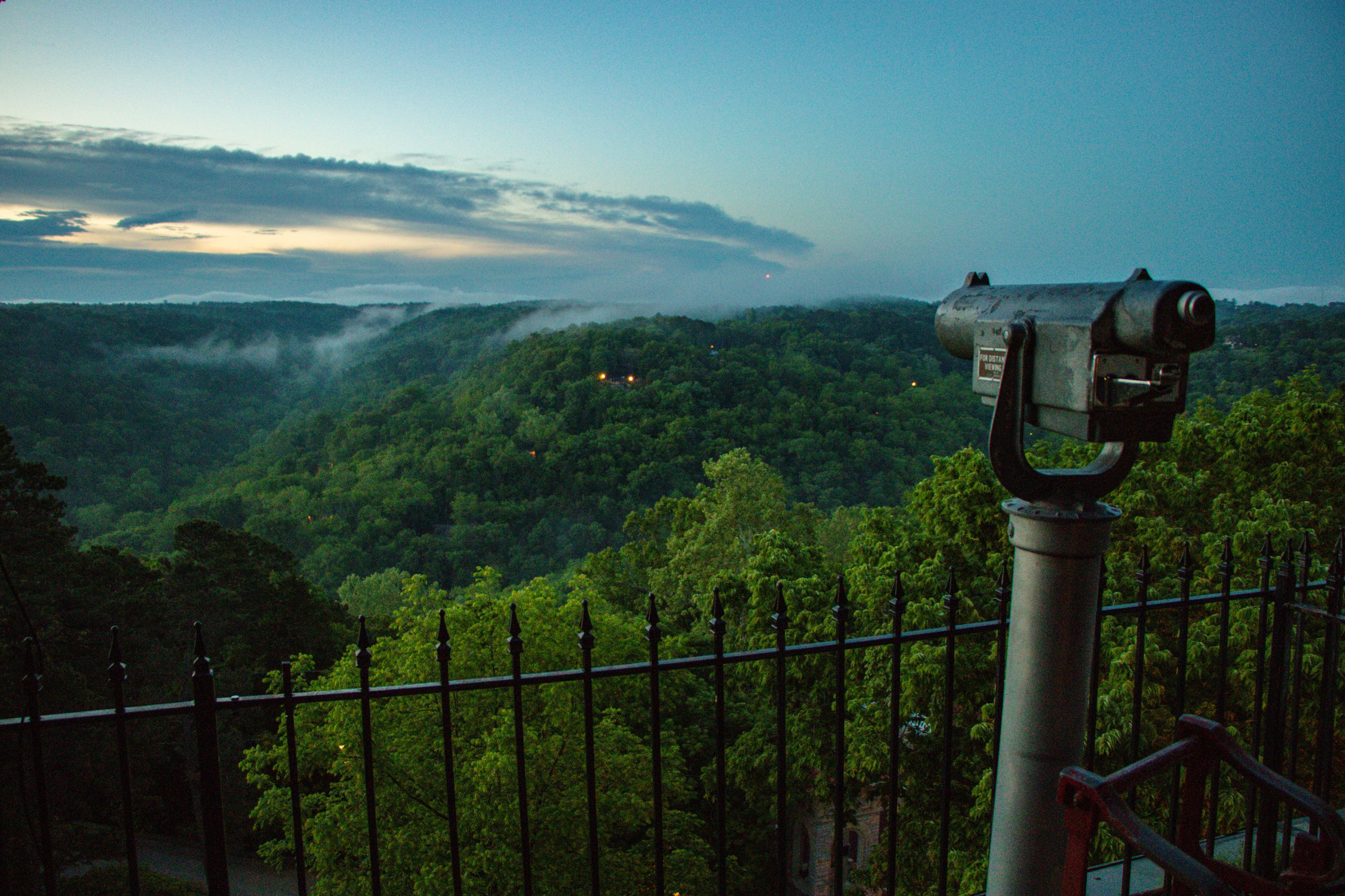 a telescope overlooking a forest