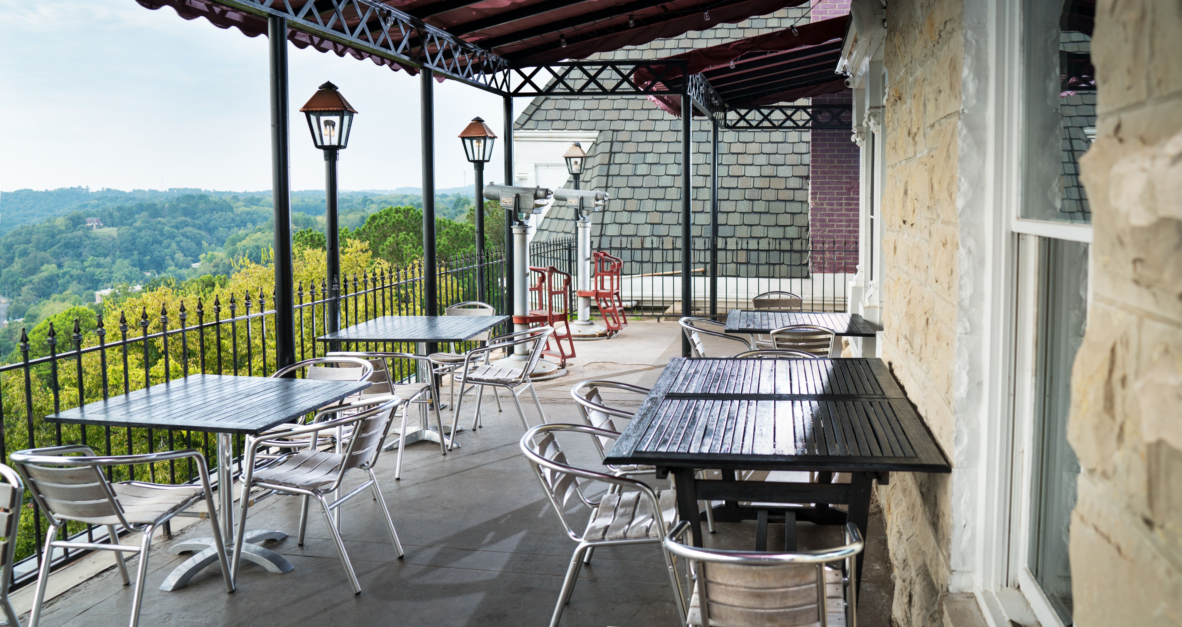 a patio with tables and chairs