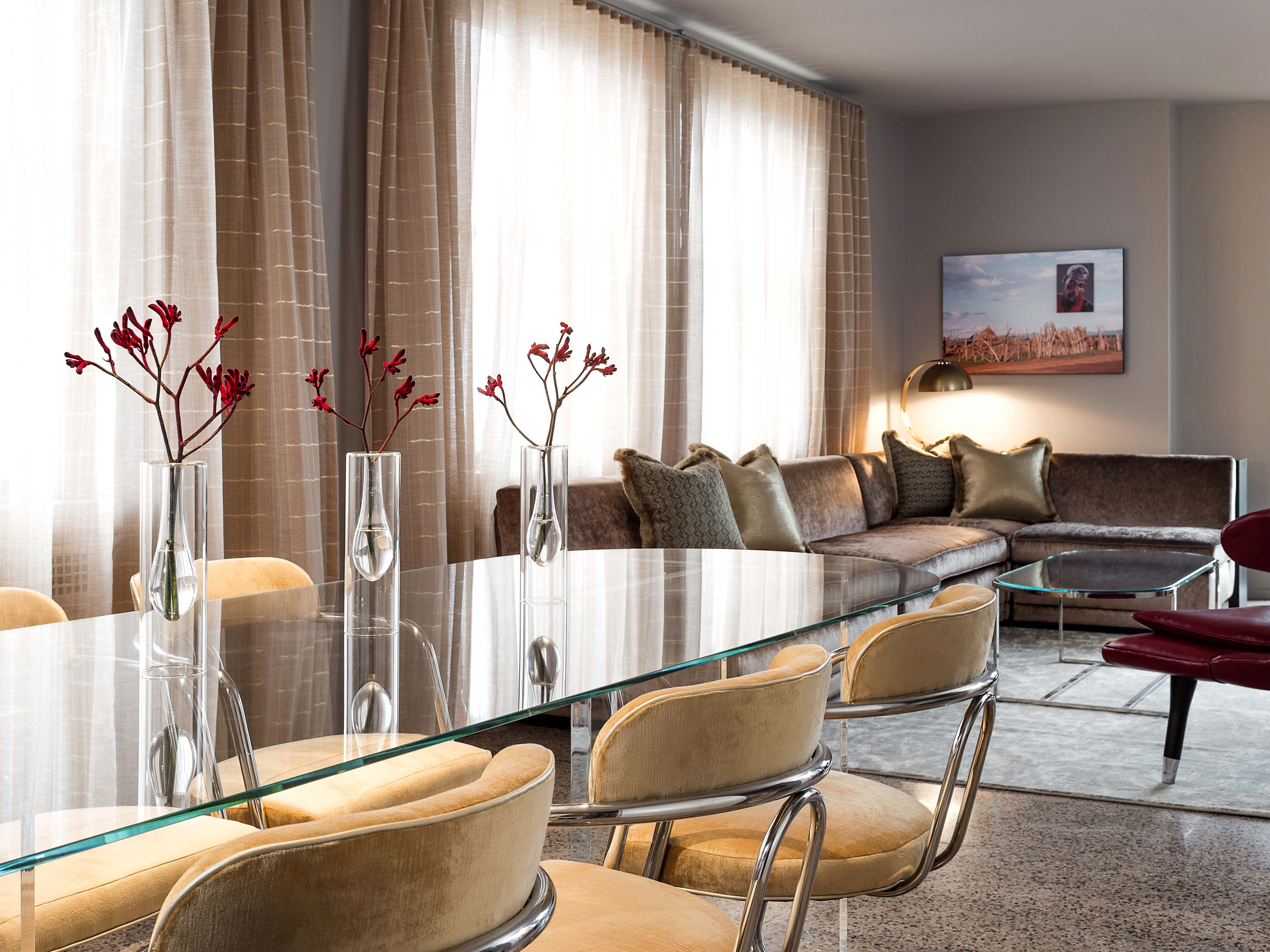 a living room with a table and chairs