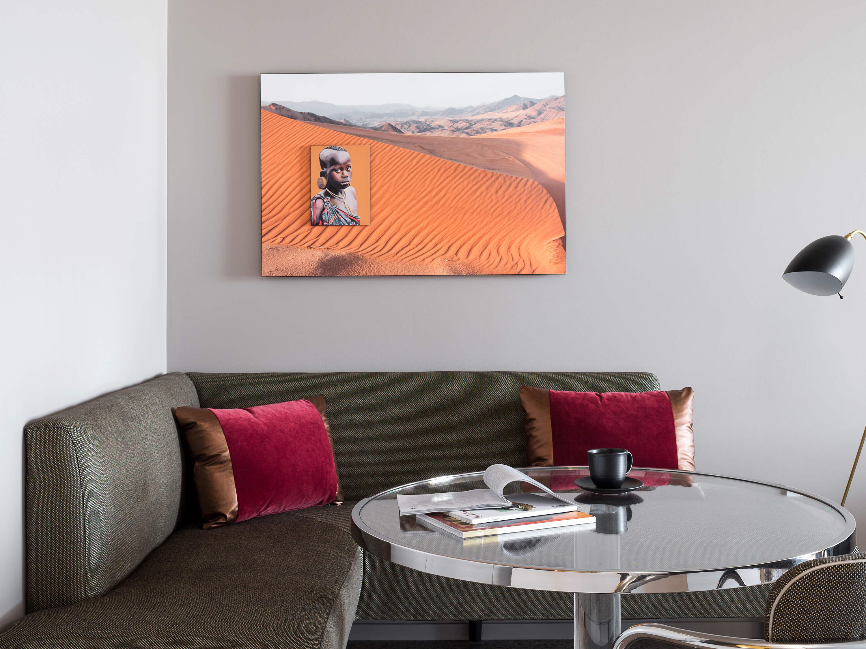 a couch with a picture on the wall
