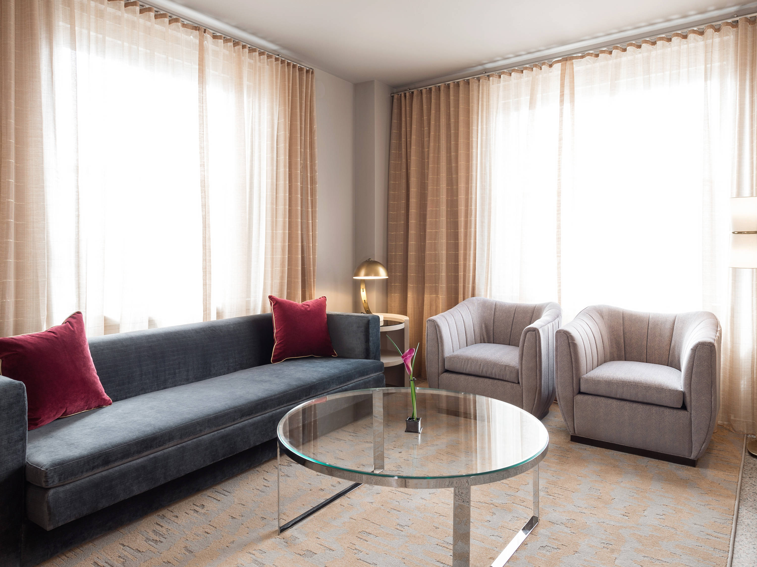 a living room with couches and chairs