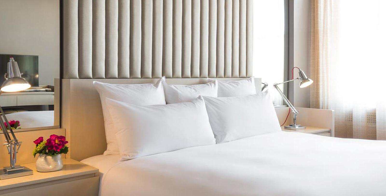 a bed with white pillows