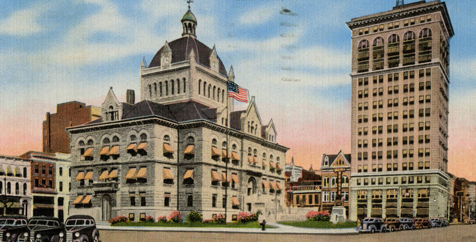 a large building with a flag on the roof