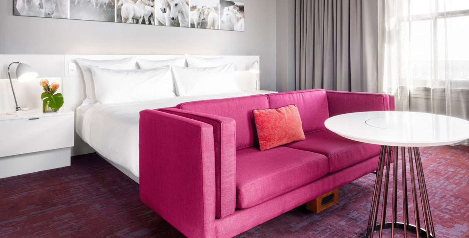 a pink couch in a room