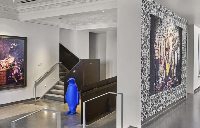 a blue penguin statue in a hallway