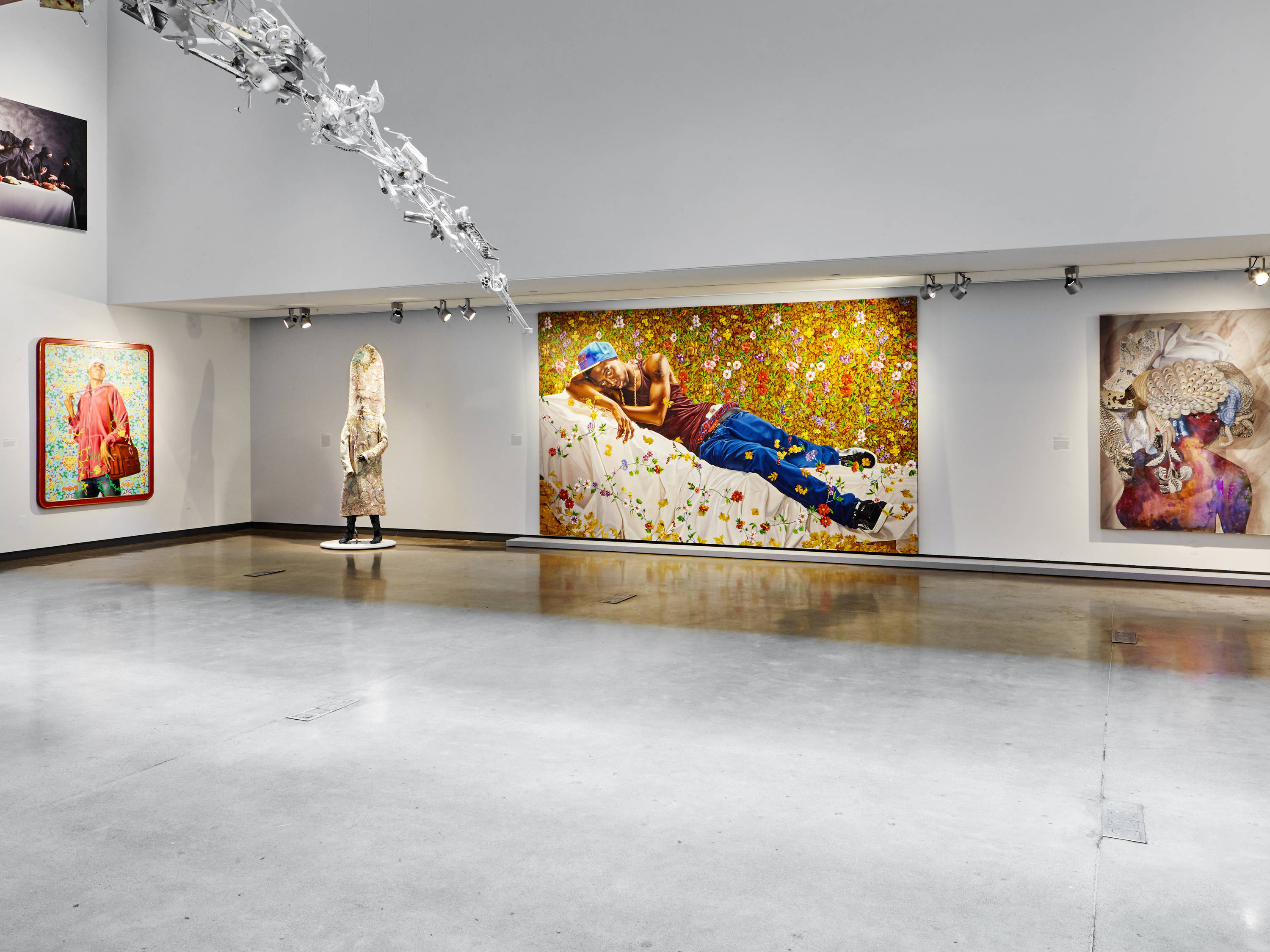 a room with a large painting on the wall