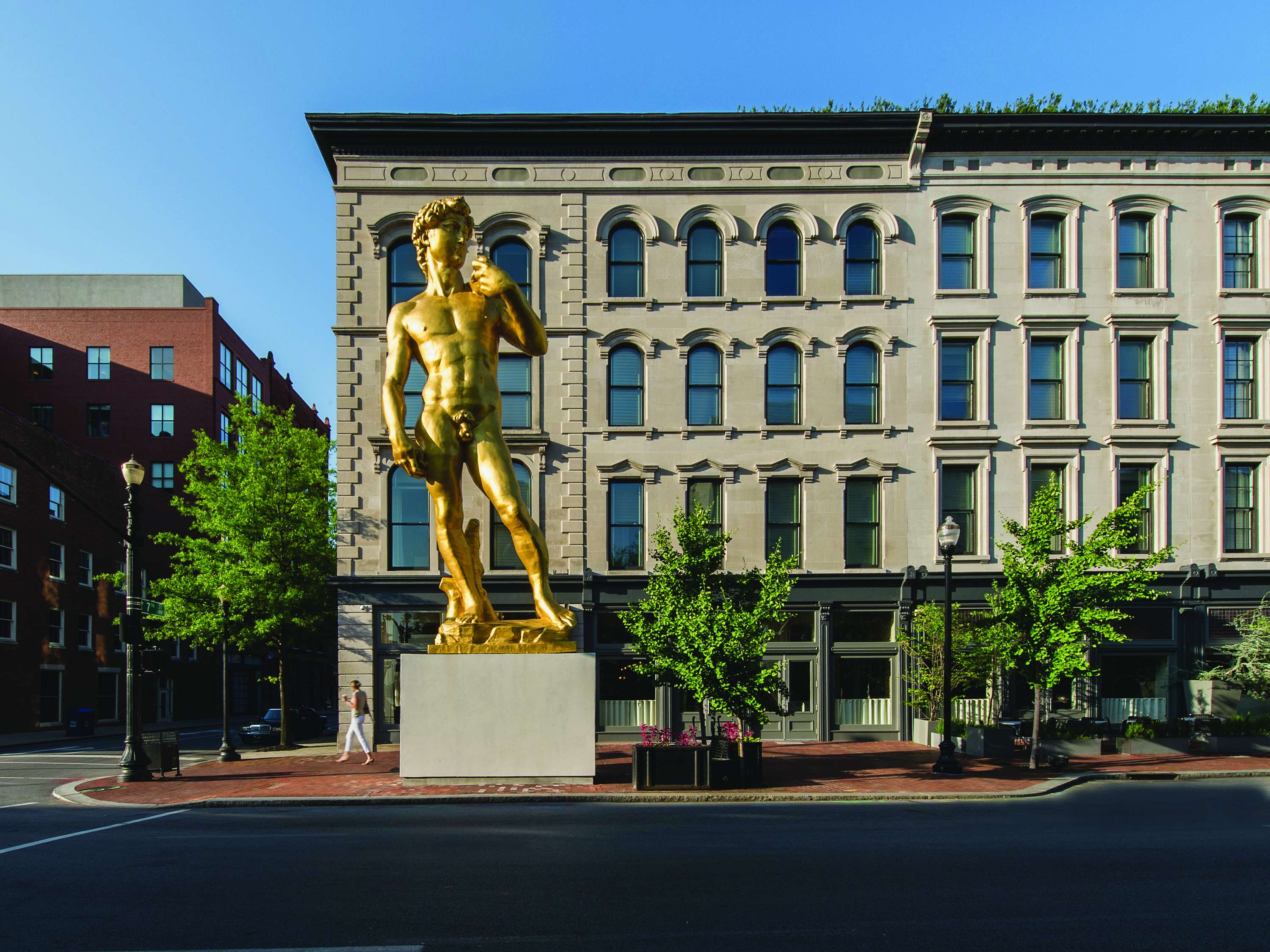 a statue of a man in front of a building