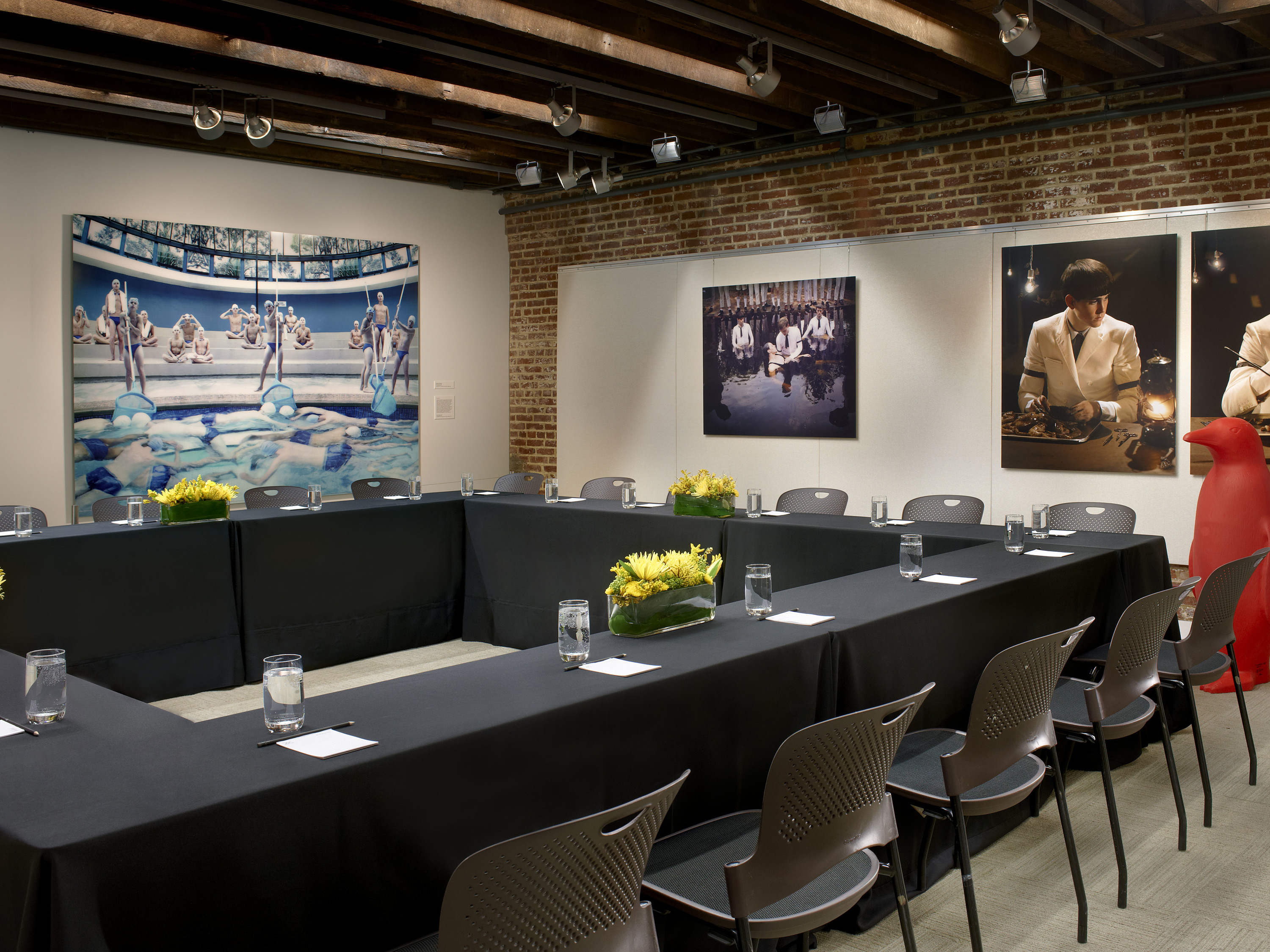 a room with a long table and chairs