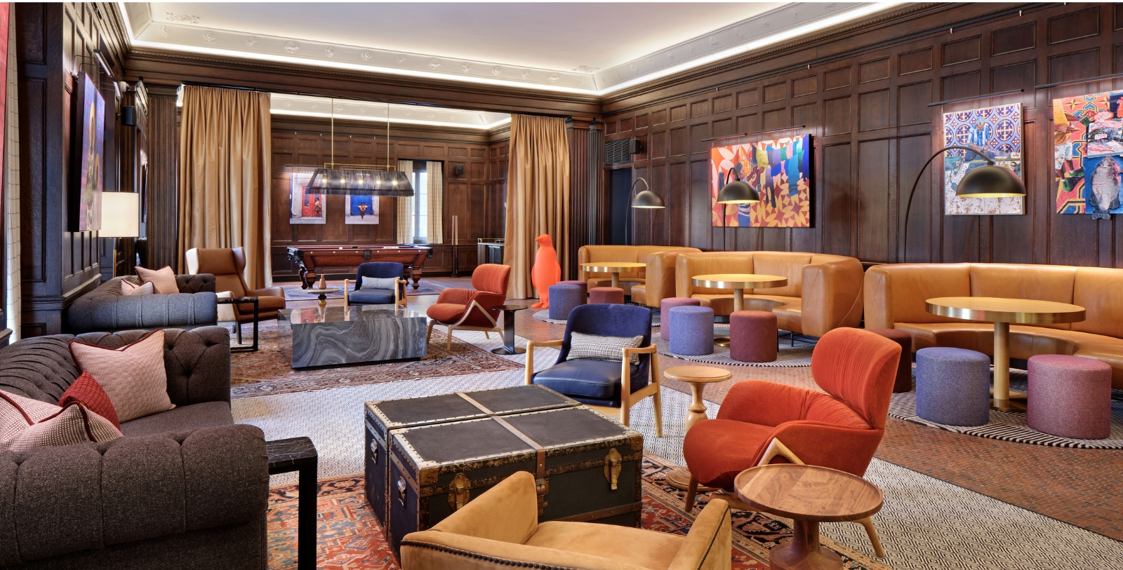 a room with a large area with chairs and tables