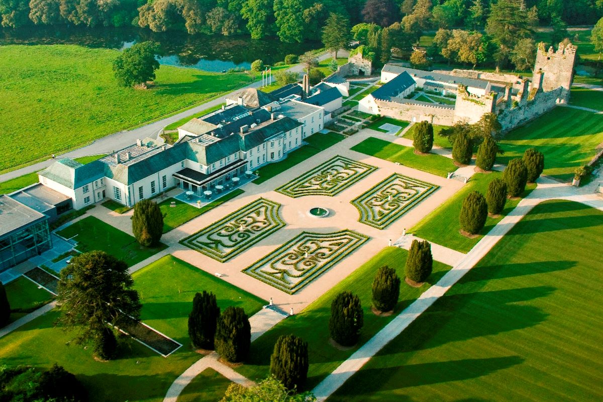 a large building with a large courtyard and trees