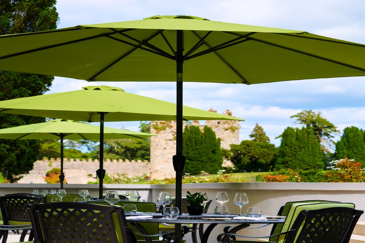 a table with umbrellas and chairs