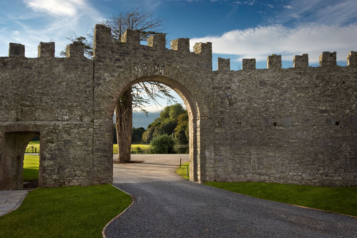 a stone wall with a stone arch