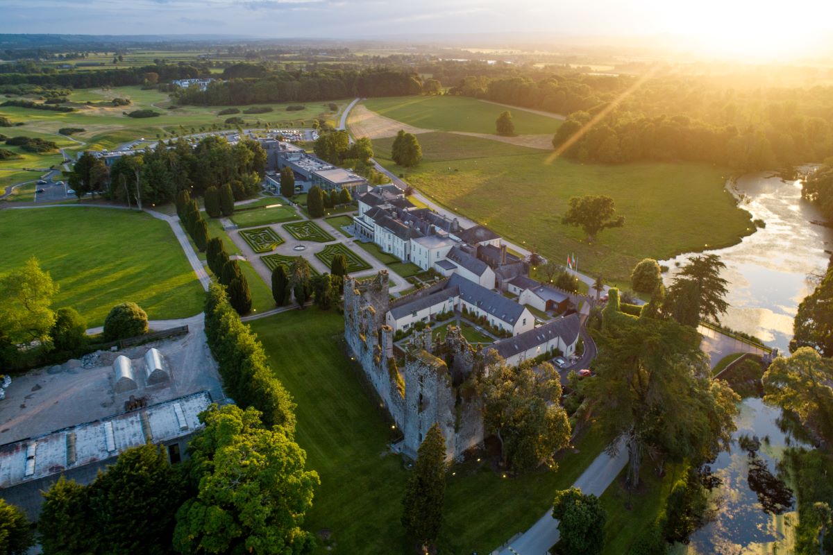 a large building with a stone wall and a large stone castle
