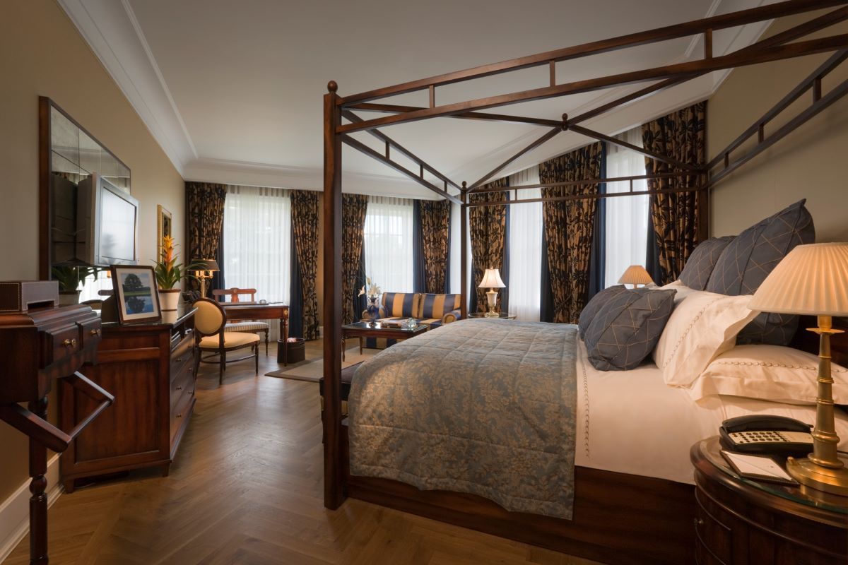 a bedroom with a four poster bed
