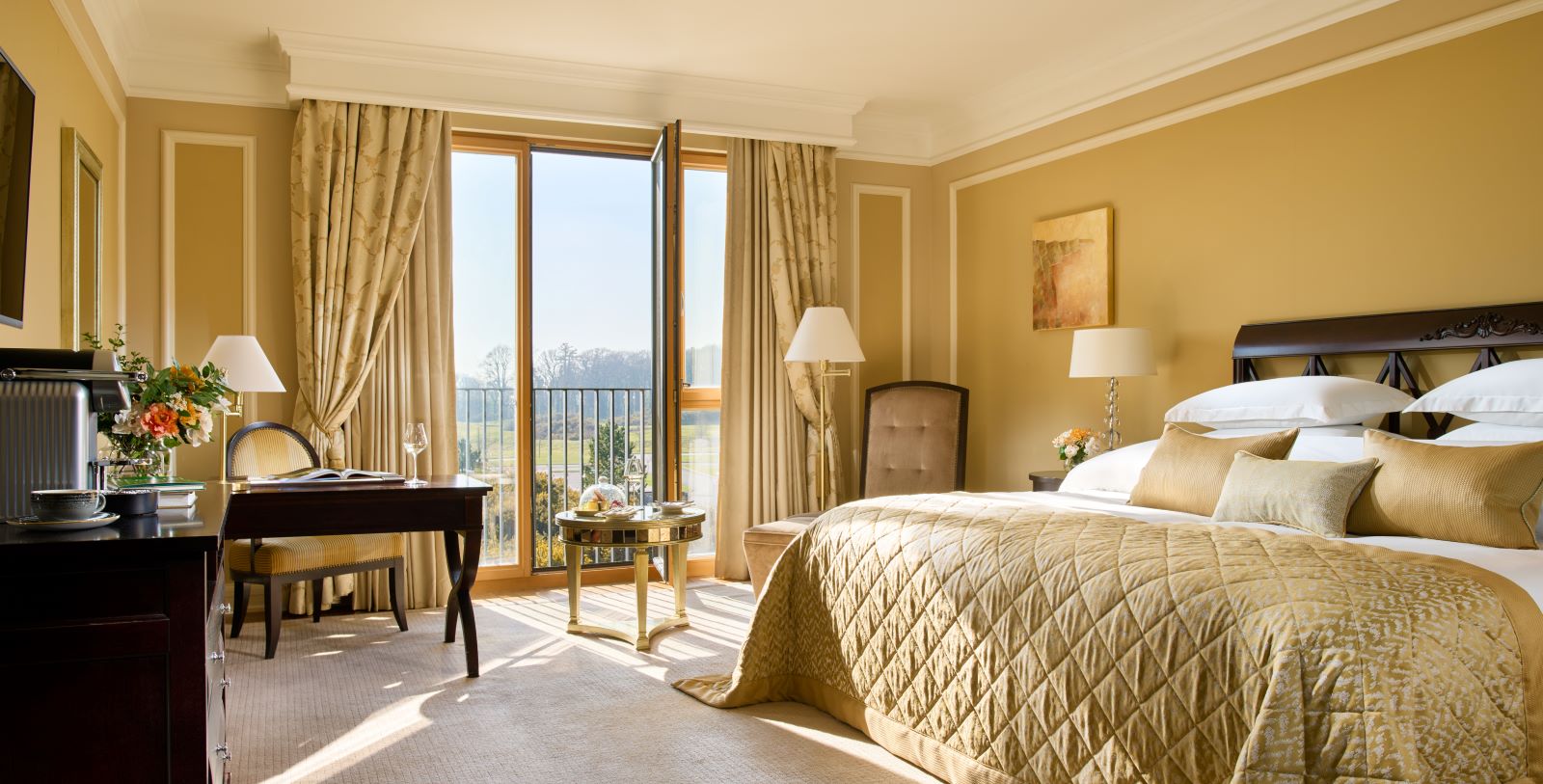 a bedroom with a bed and a table