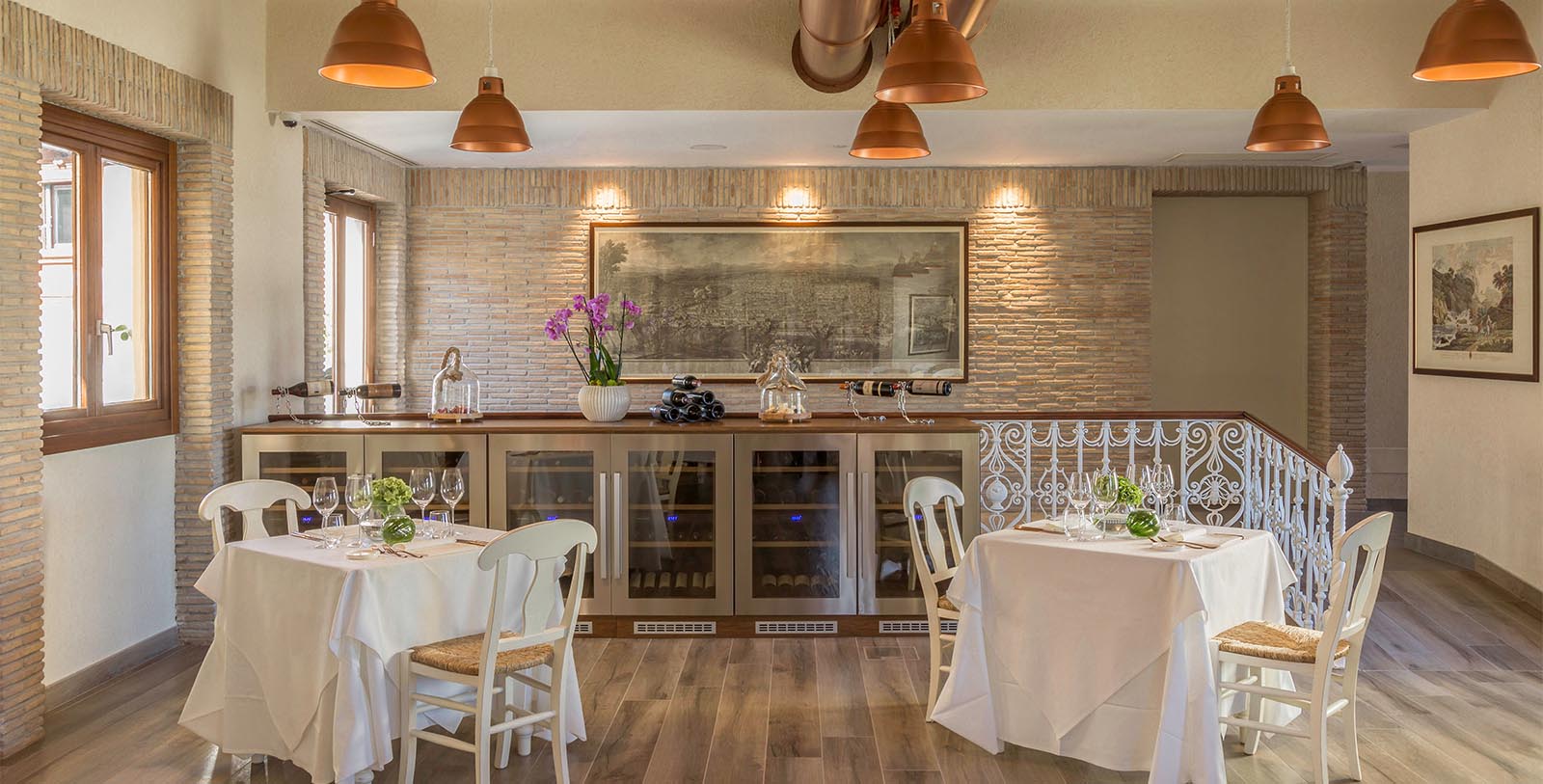 a room with a table and chairs and a wine rack