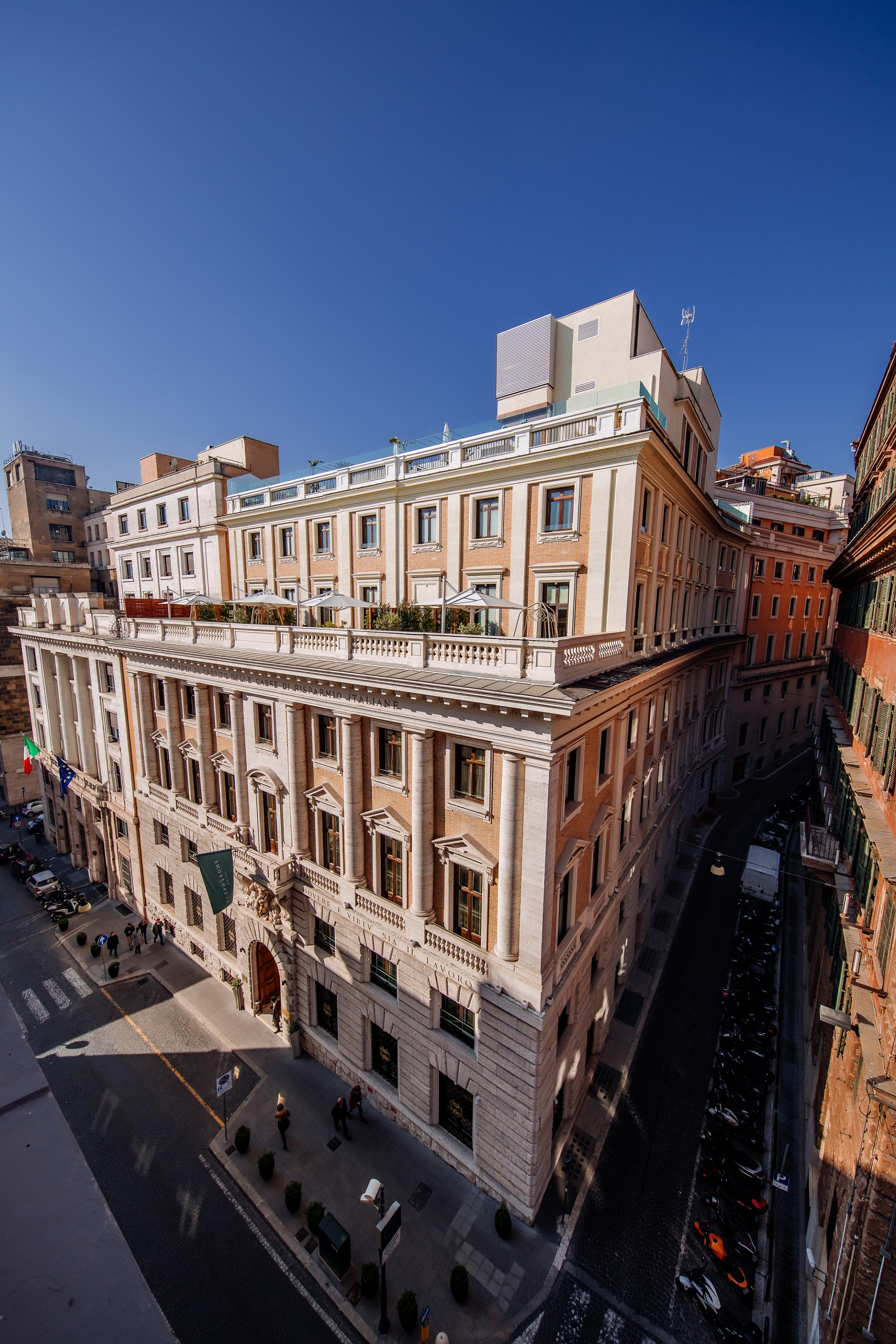 a building with many windows and a street in the background