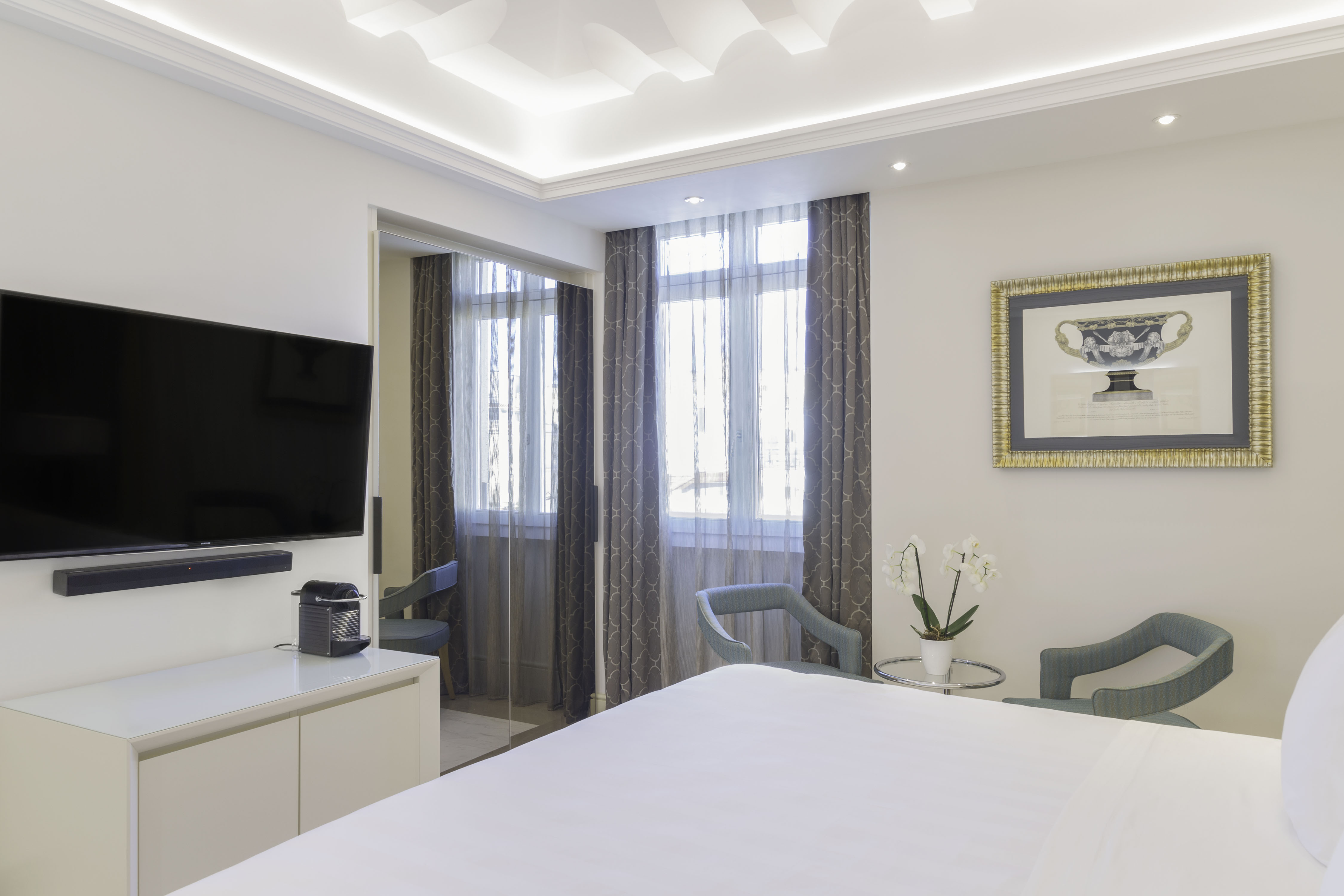 a room with a bed and a tv