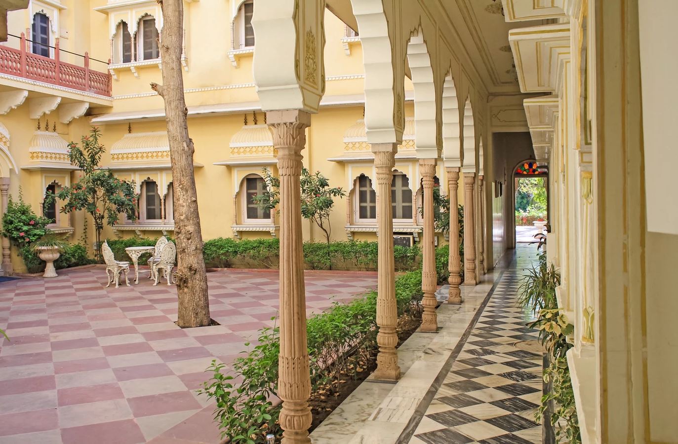 a building with columns and a tile floor