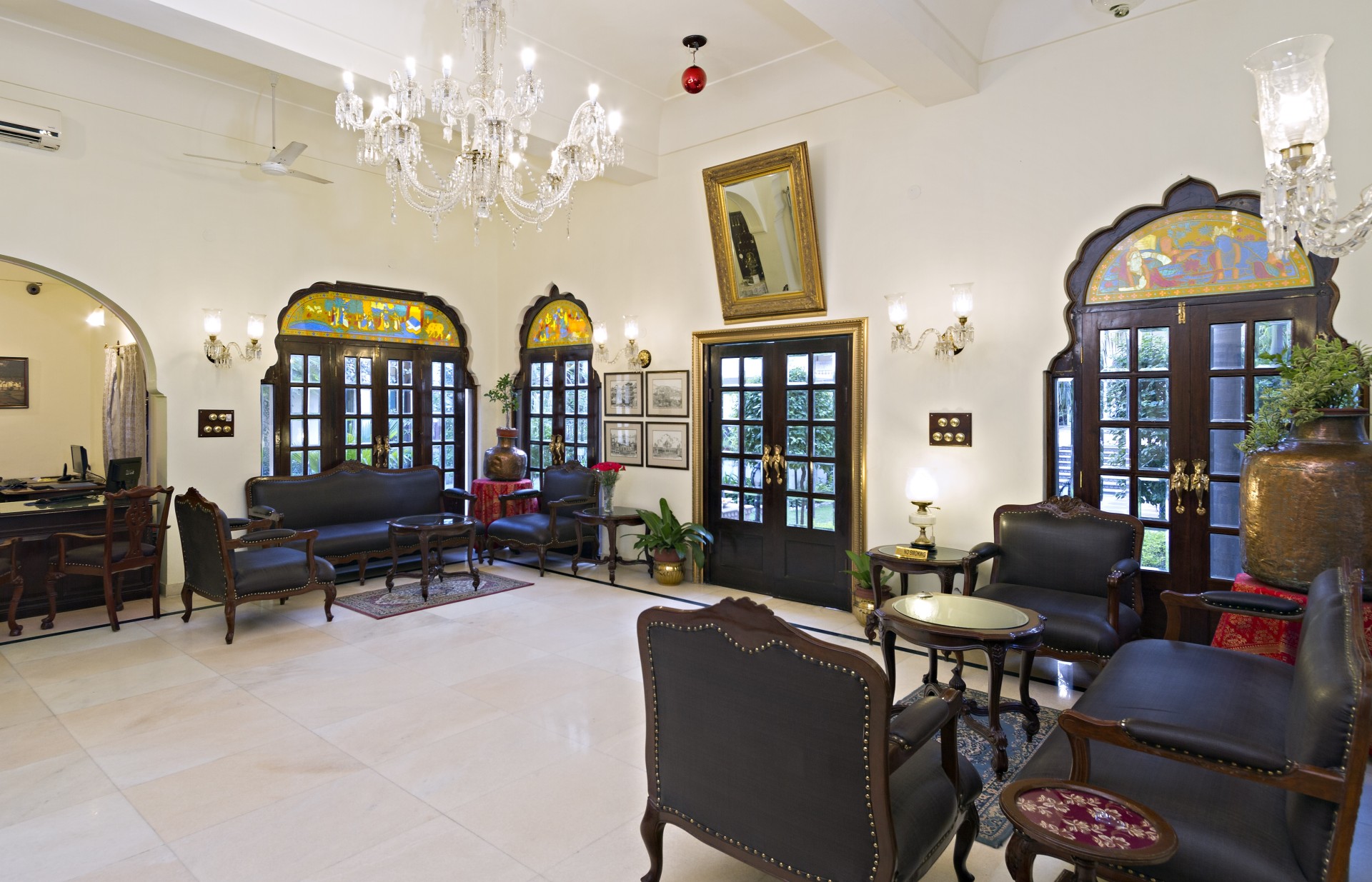a room with chairs and a chandelier