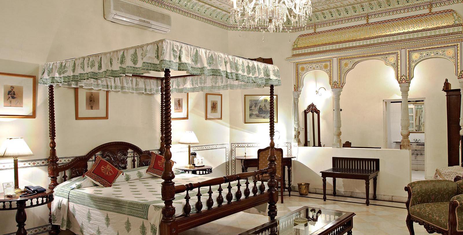 a bedroom with a four poster bed