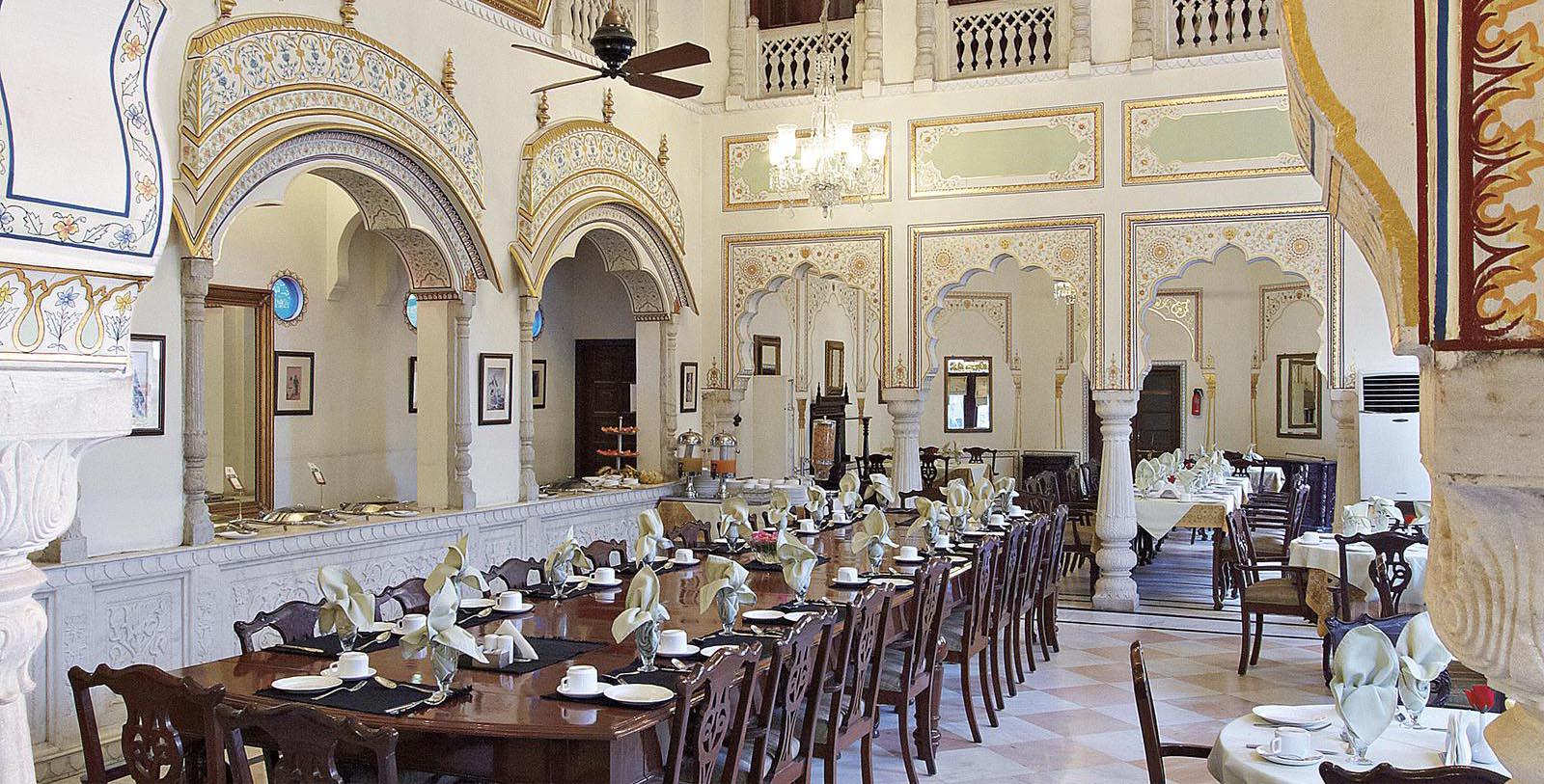 a large room with a large table set for a meal
