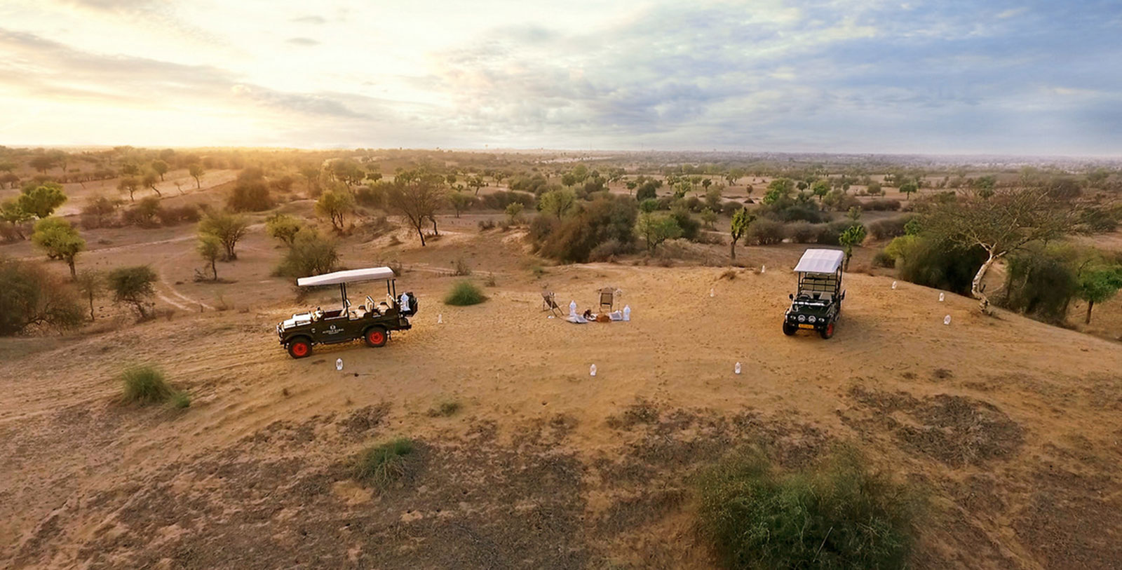 a group of vehicles in a desert