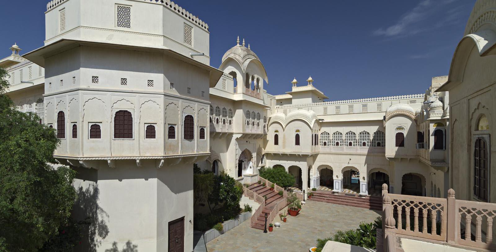 a white building with arched windows