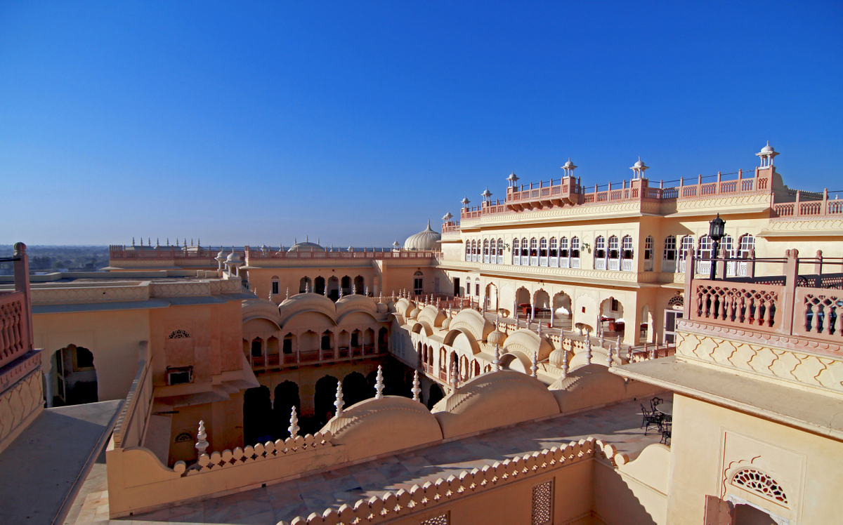 a building with many arches and a balcony
