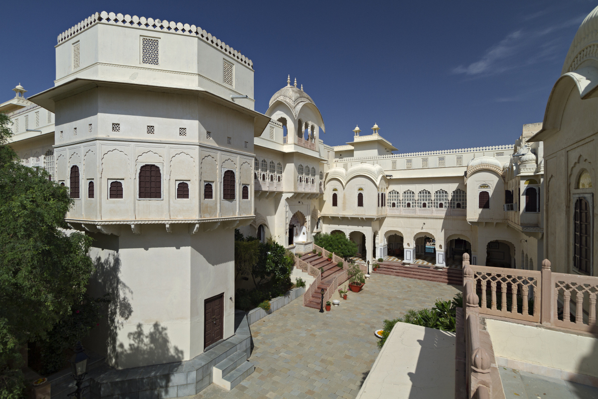 a white building with arched windows