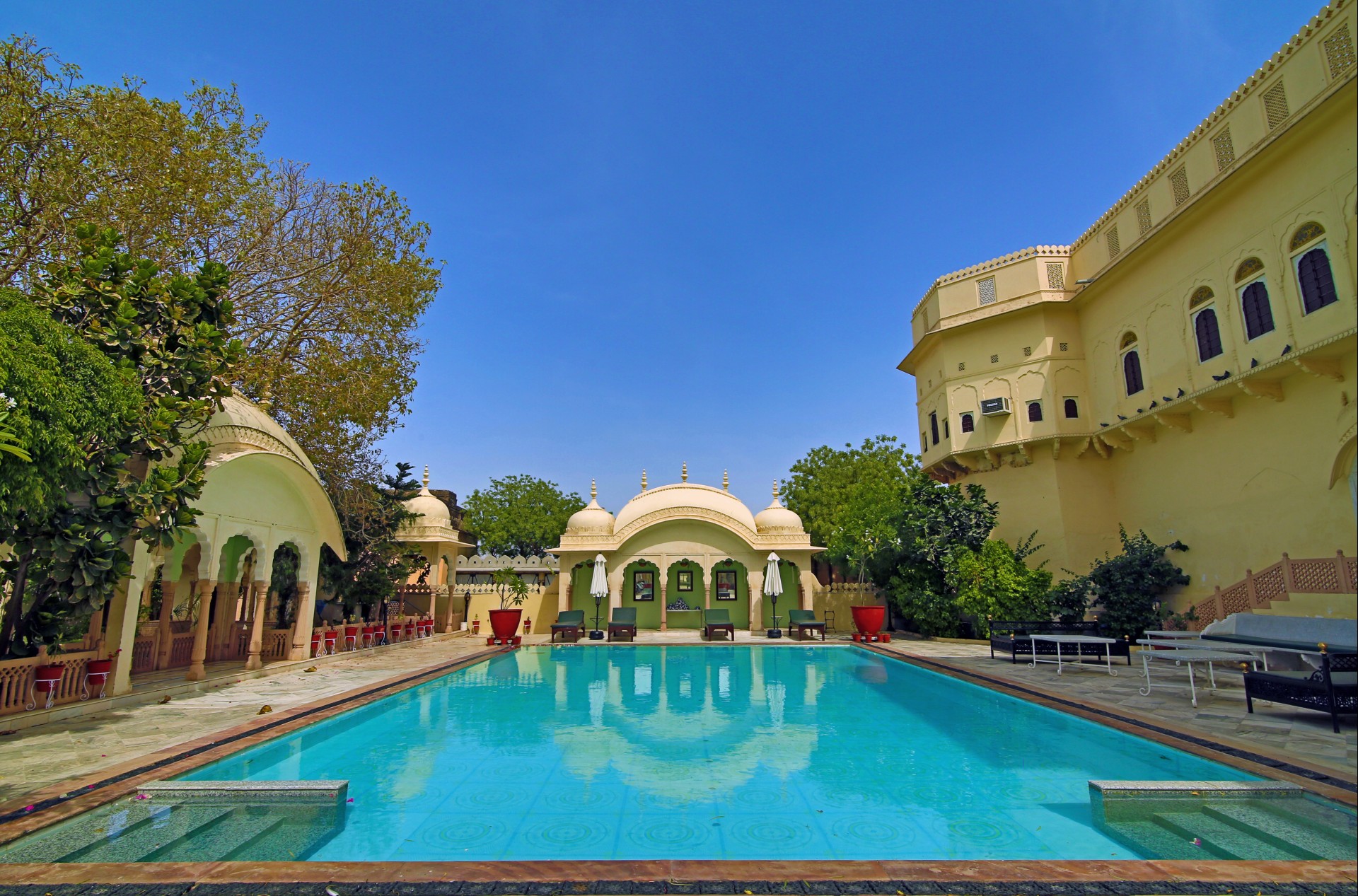 a pool with a building around it