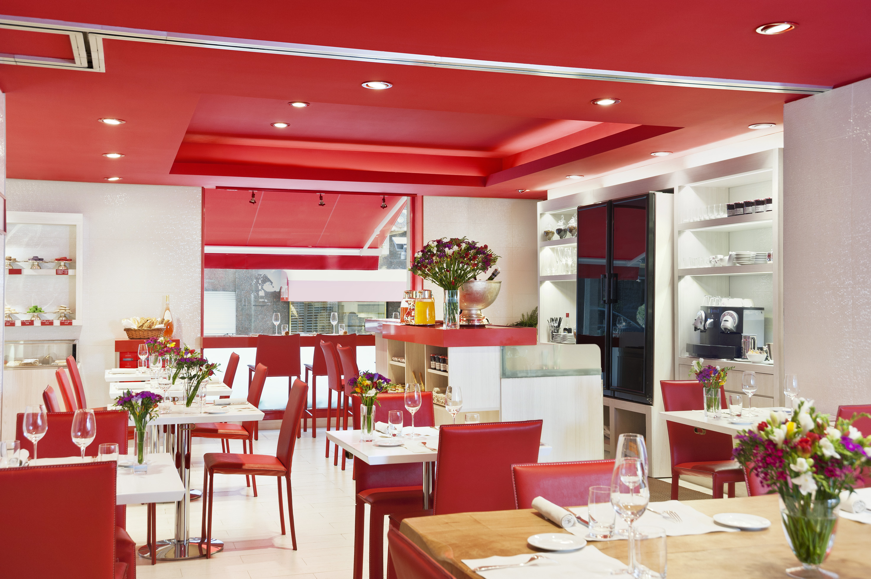 a restaurant with red and white furniture