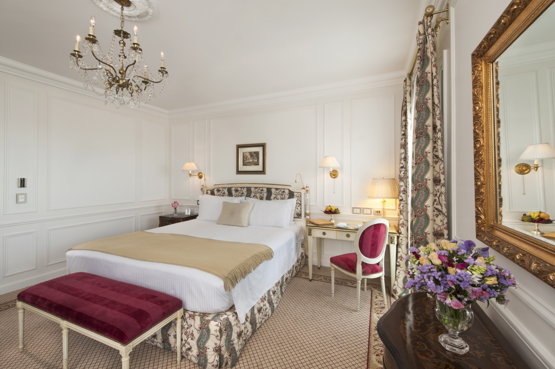 a bedroom with a bed and a desk