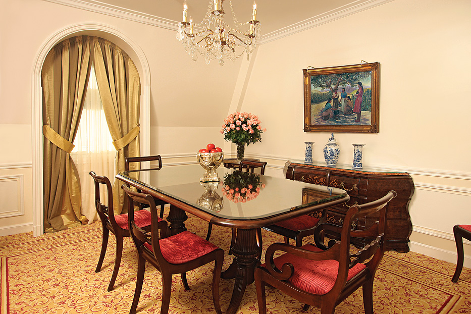 a dining room with a table and chairs