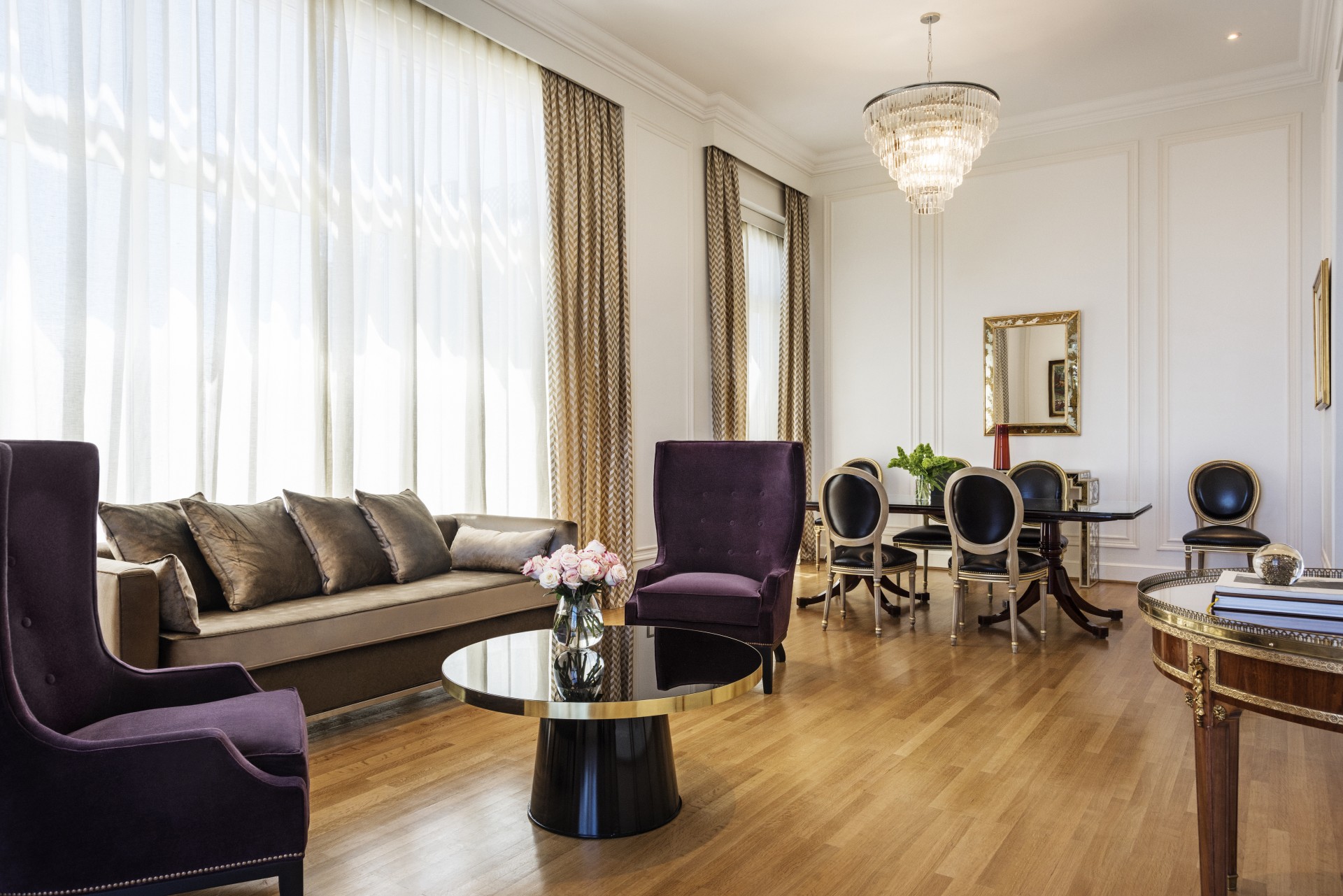 a living room with a couch and chairs