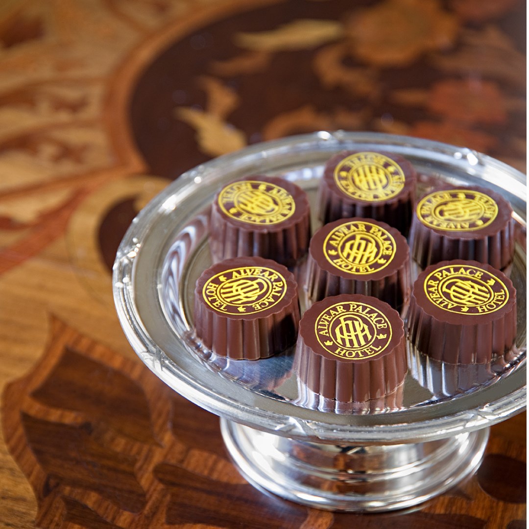 a group of chocolates on a silver tray
