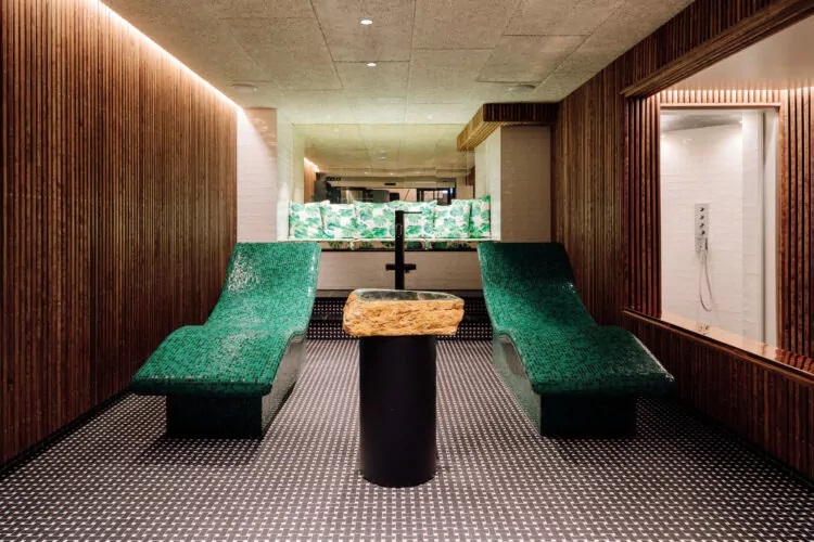 a room with two green chairs