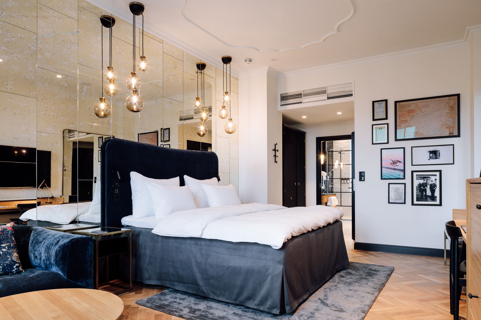 a bed with a bed frame and a mirror above it