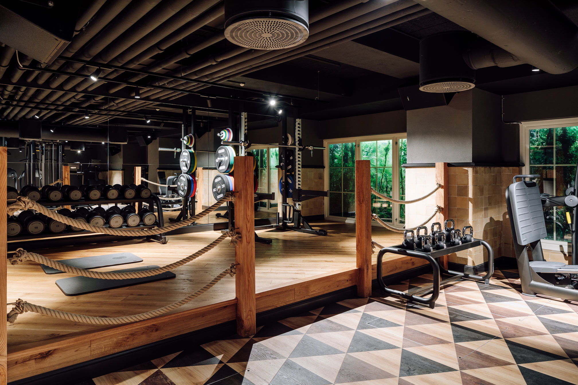 a gym with equipment and rope around it