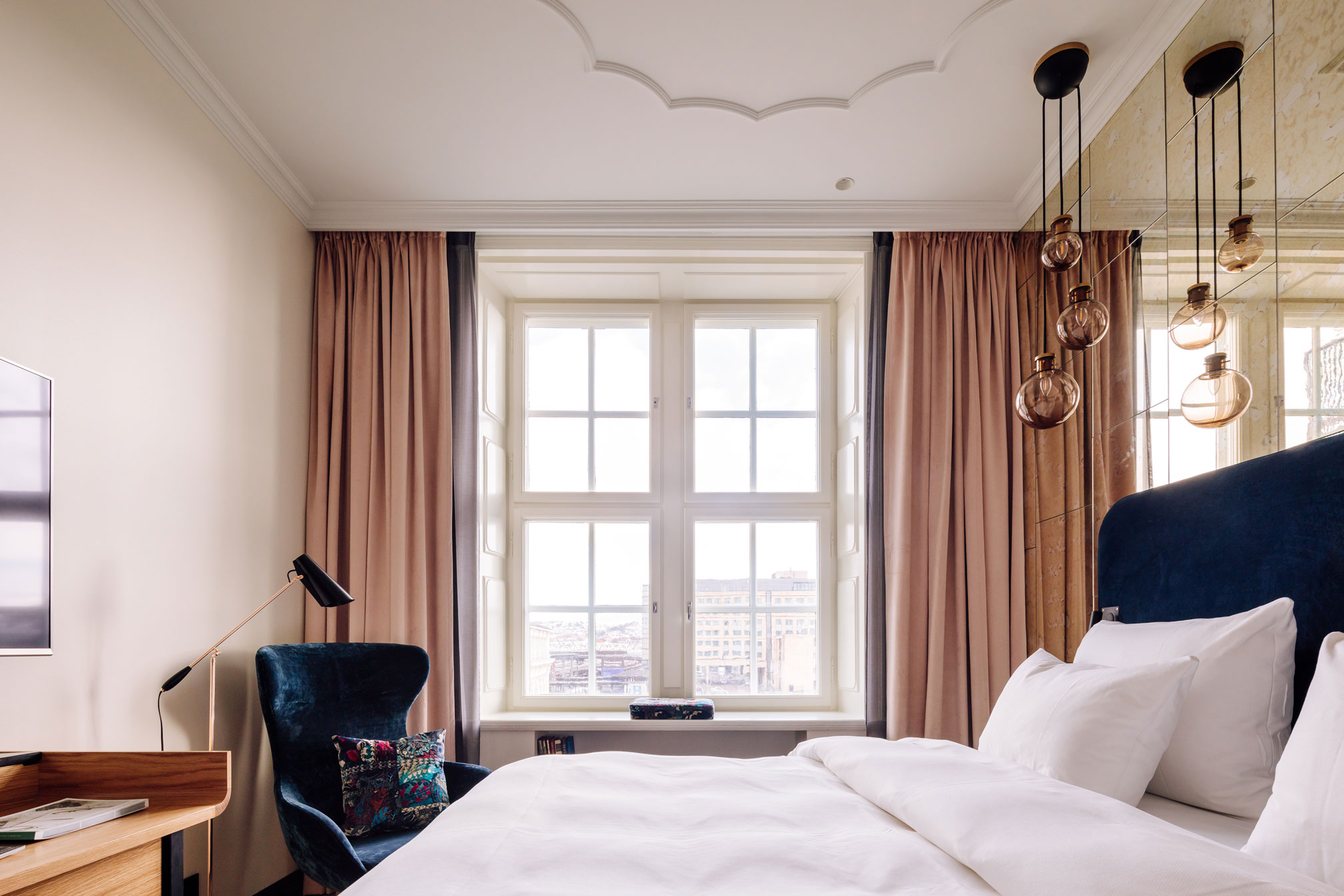 a bedroom with a bed and a chair
