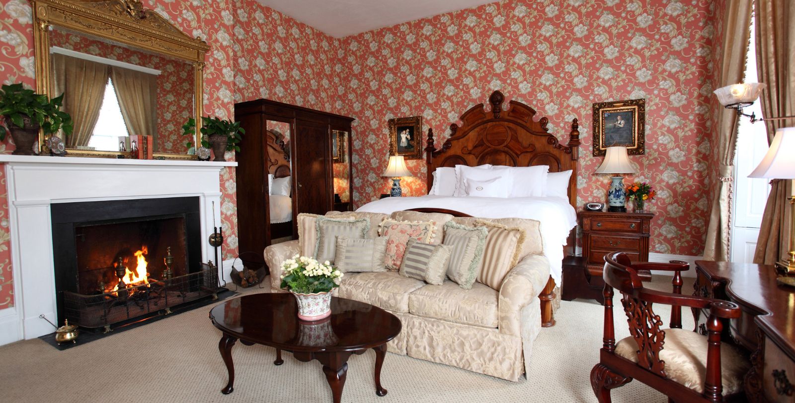 a room with a bed and a fireplace