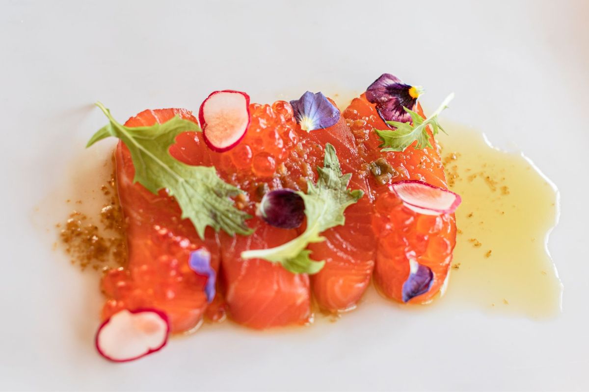 a piece of food with flowers on top